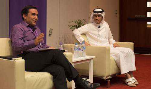 Al Rumaihi (right) in a discussion with Professor Al-Hroub [Photo by Awad Al-Radi]