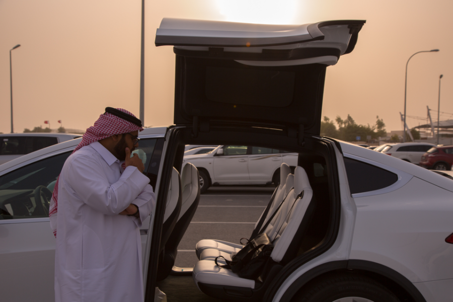 Abdullah Al Kuwari with his electric car, an imported Tesla Model X. Photo: Saad Ejaz.