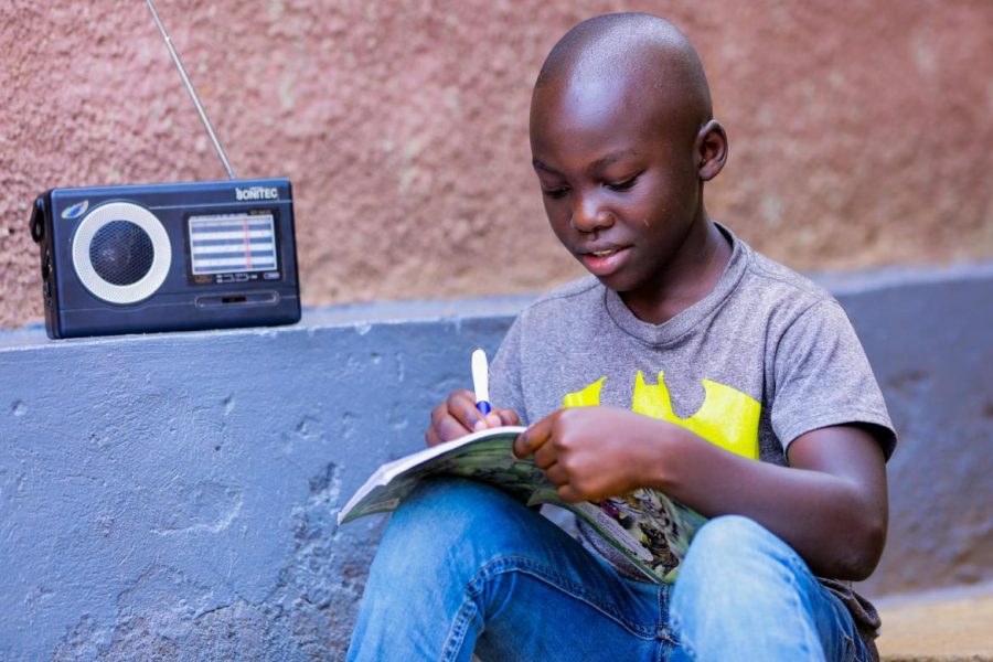 Igihozo Kevin, 11, studies at home due to coronavirus-related school closures in Rwanda, listening to his Primary 5 lessons on the radio every day. (Photo/ UNICEF)